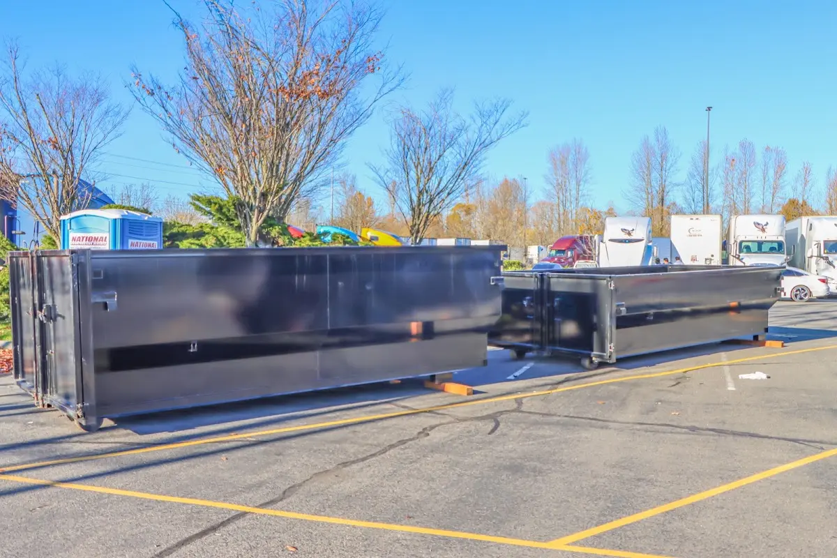 Professional dumpster rental service with roll-off container on residential driveway in Lower Macungie
